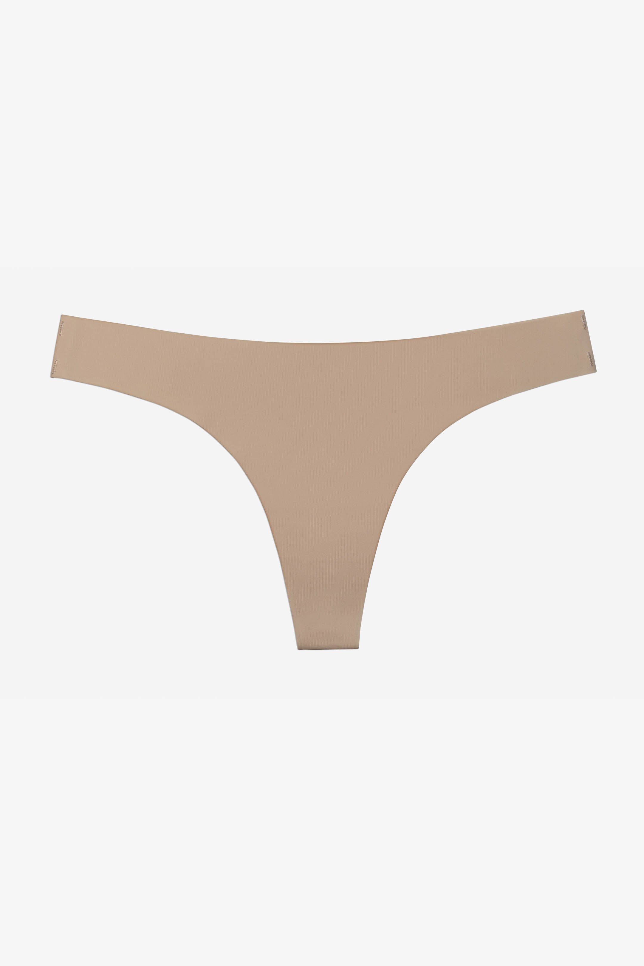 "3-pack sømløse tynne stringtruser i elastisk, mykt stoff i beige, sort og hvit uten synlige kanter, komfortabel passform"
