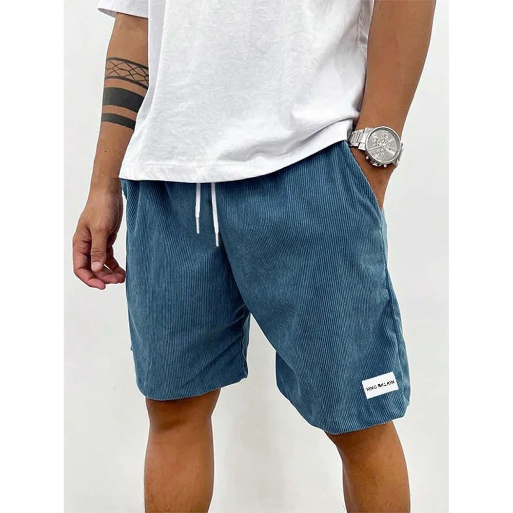 "Blå corduroy-shorts for menn med myk struktur, avslappet passform, ideell for casual stil og uformelle utflukter."