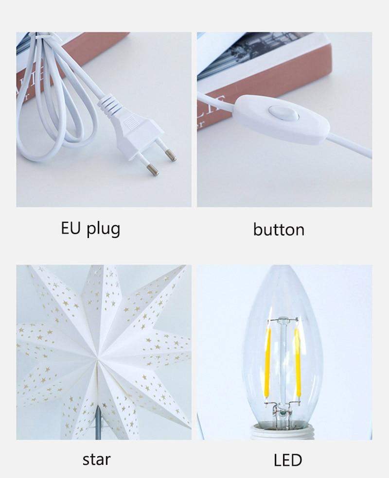 Bordlampe med stjernedesign og synlig trebase, gir koselig stemningslys i ethvert rom.