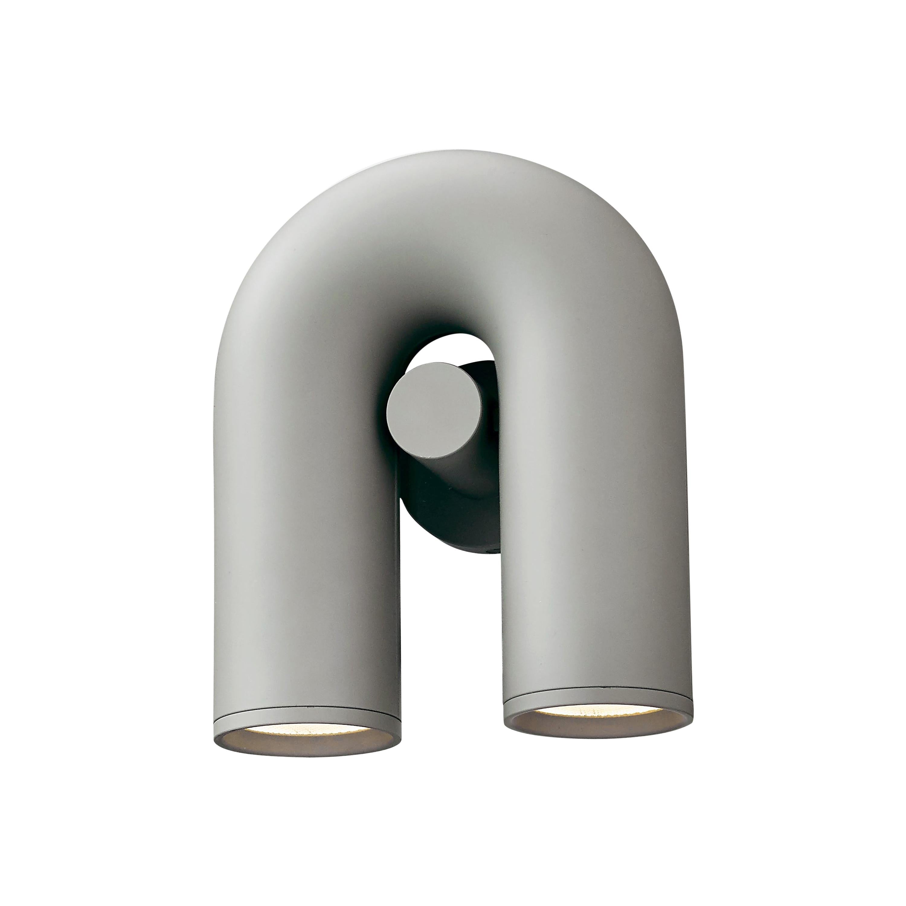 "Cirkus justerbar LED vegglampe med U-formet modul, elegant design for moderne innendørs belysning."