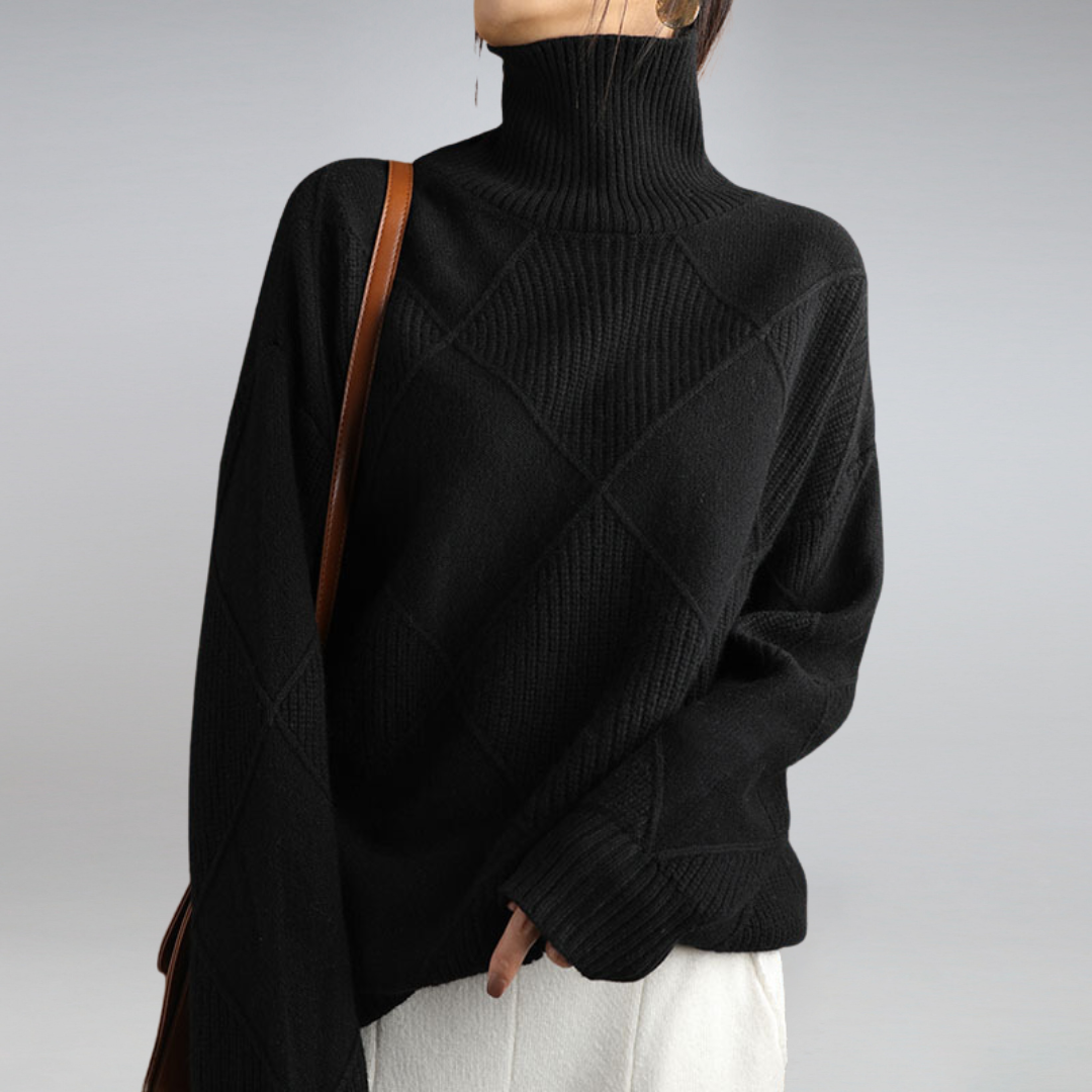 Detalj av mansjett på dame polotopp, myk kashmir genser, elegant og komfortabel topp.