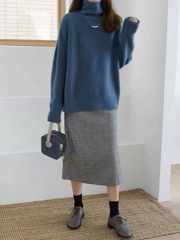 Stilren damegenser med polokrage og avslappet passform, tilbyr komfort og en tidløs look.