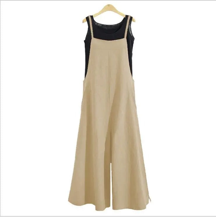 Ermeløs overall for kvinner. Løs passform, vide ben. Perfekt sommerplagg, casual og elegant stil.
