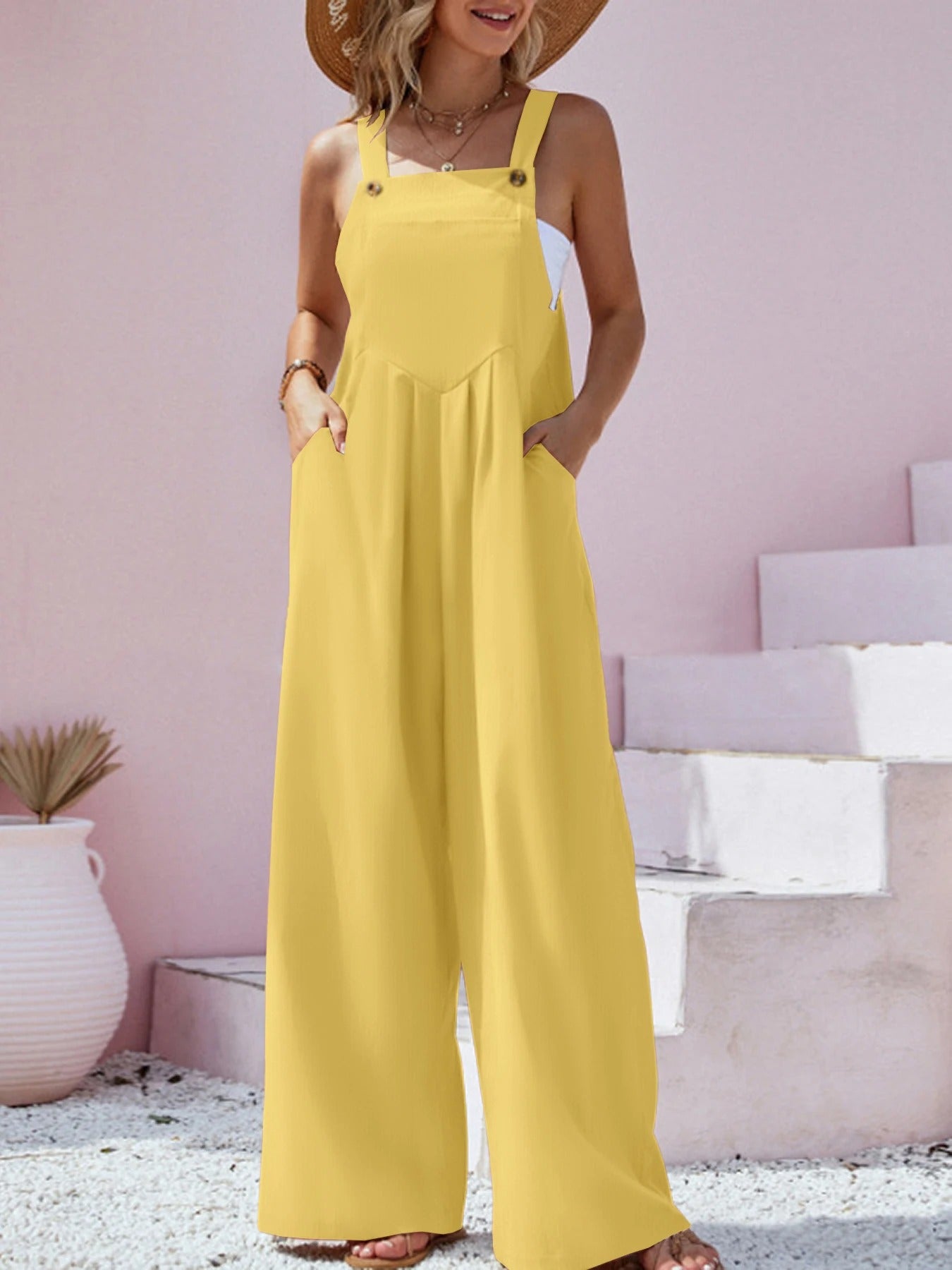 Hverdags jumpsuit: Komfortabel damejumpsuit med brede bukseseler, løs og vidbeint passform.