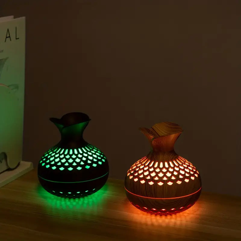 Dekorativ aromaspreder med blomster, skaper rolig atmosfære og sprer eteriske oljer for velvære hjemme.
