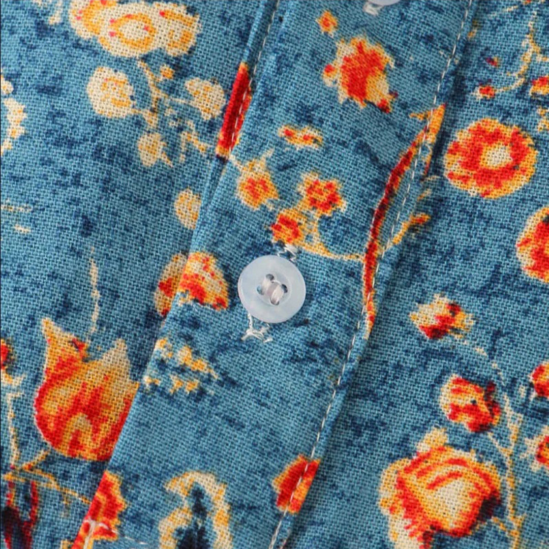 "Elegant blå unisex skjorte med moderne design og tropisk stil, perfekt for alle sesonger og enhver anledning."