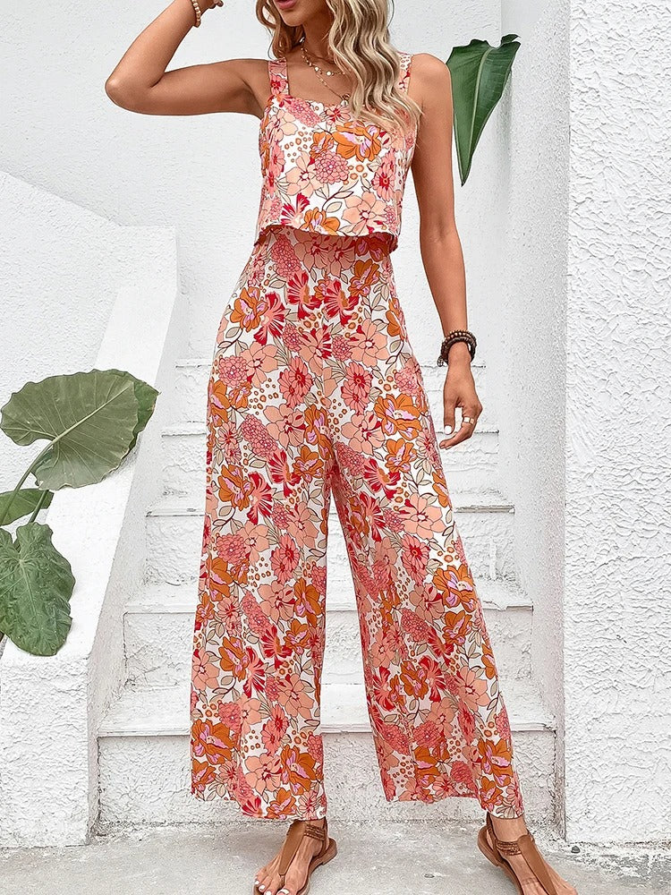 Oransje og lilla blomstertrykk romper for kvinner, ryggløs design som gir en elegant sommerlook.