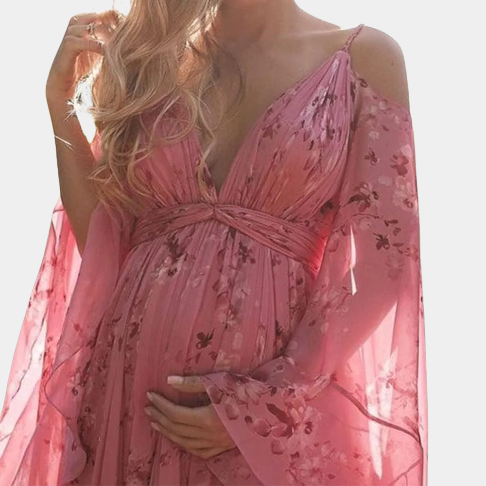 "Elegant blomstrete maxikjole med paisleymønster og blondekanter, perfekt for sommerlige anledninger og elegante sammenkomste