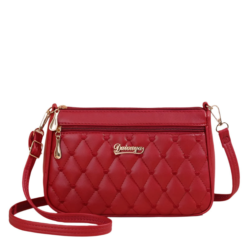 Dameveske som viser justerbar skulderrem på brodert crossbody-veske i PU-skinn, komfortabel og stilig.