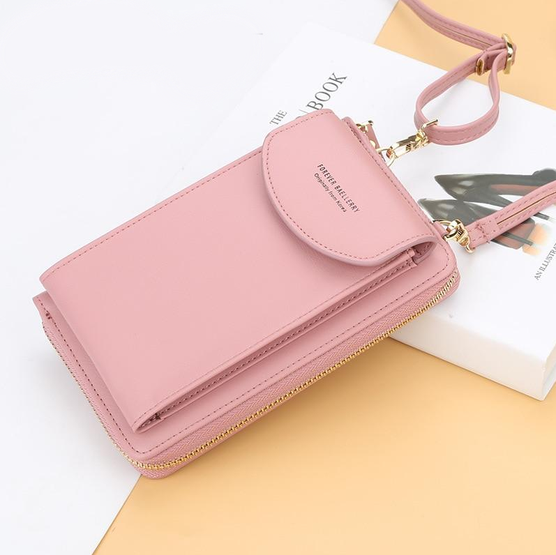 Praktisk og elegant crossbody håndveske i beige skinn, perfekt for oppbevaring av nødvendigheter.