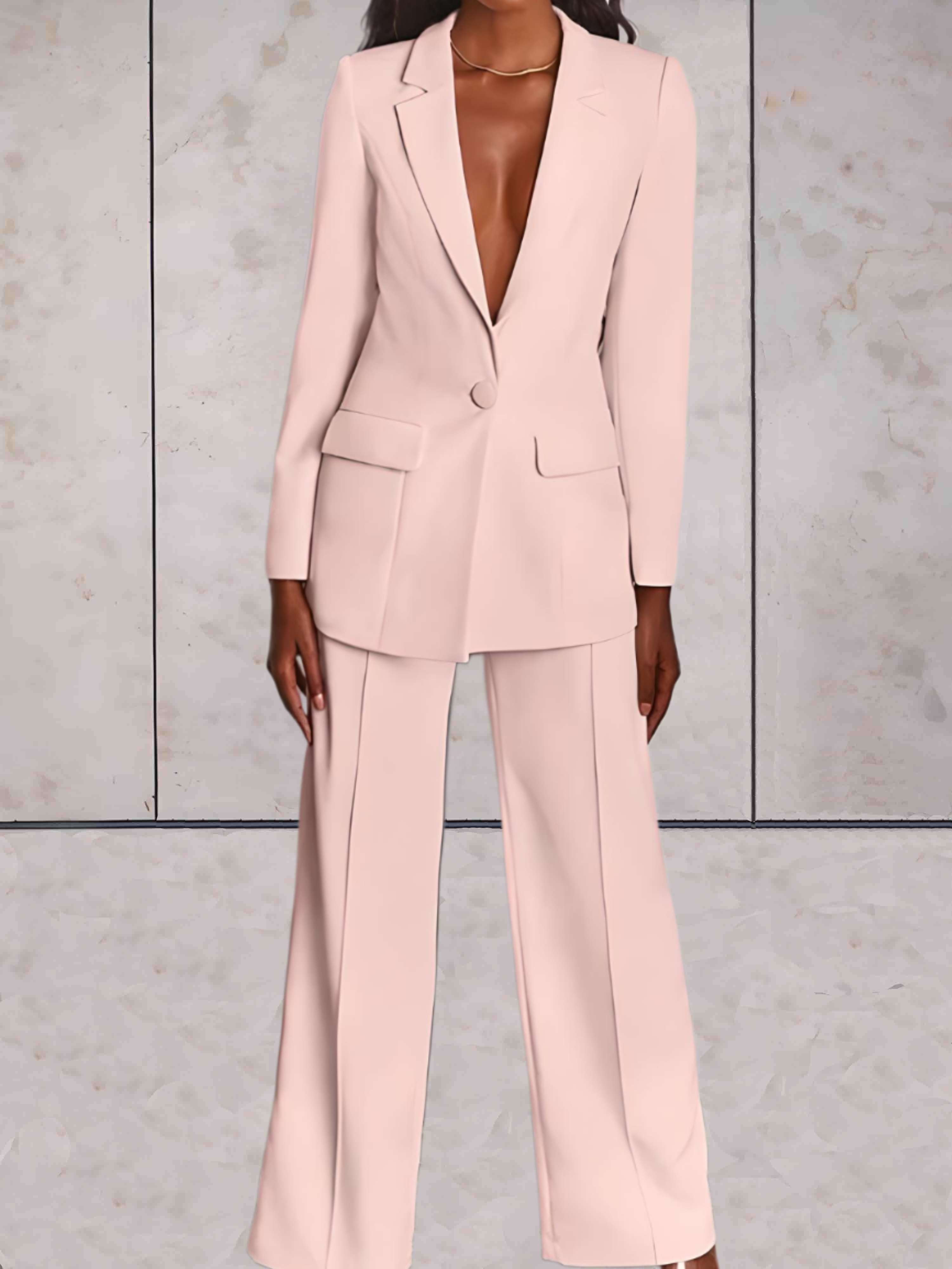 Mote dame dressett sett med løs jakke og vide ben, ideelt for et sofistikert og komfortabelt arbeidsantrekk.