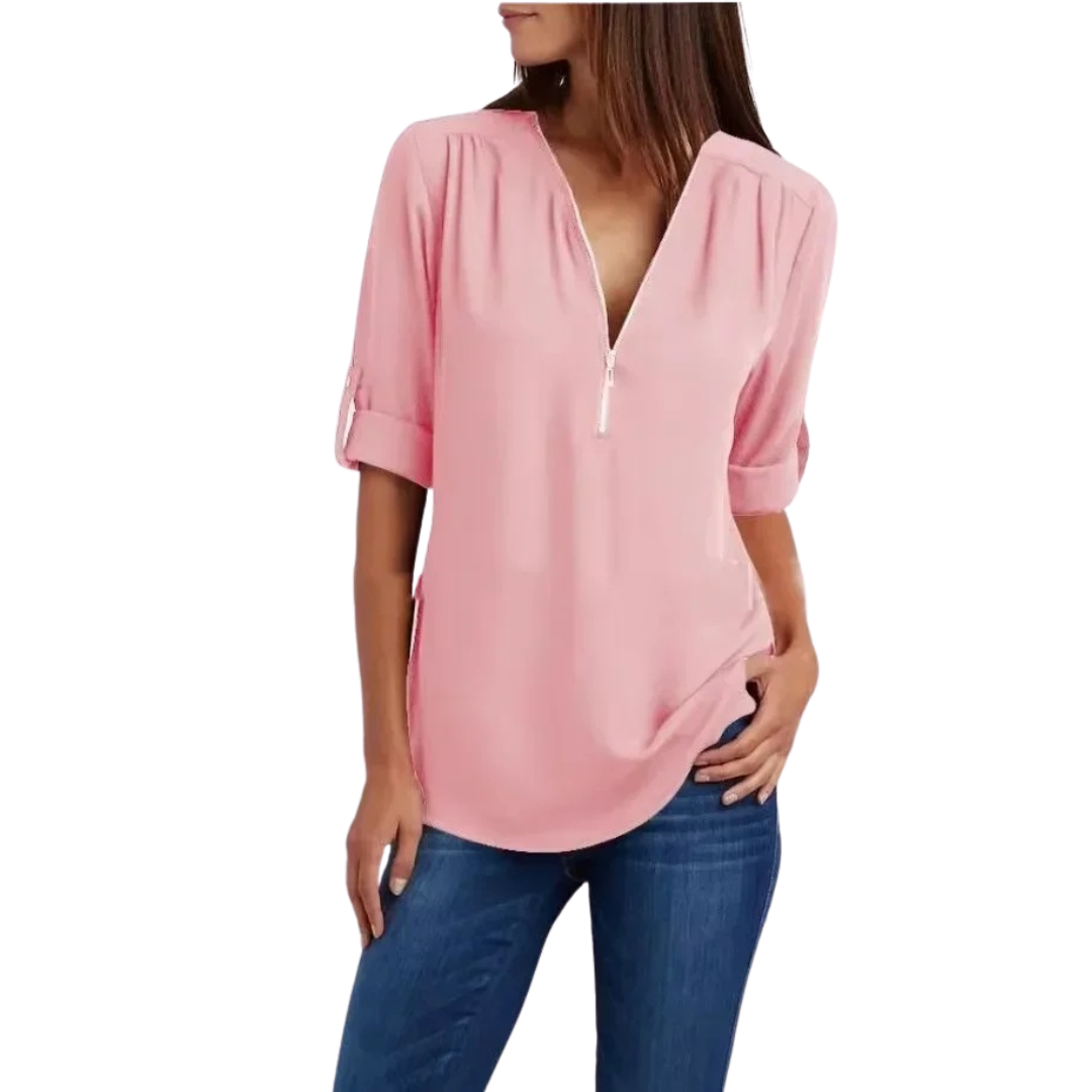 Lett og luftig damebluse med dyp V-hals, perfekt for varme sommerdager.