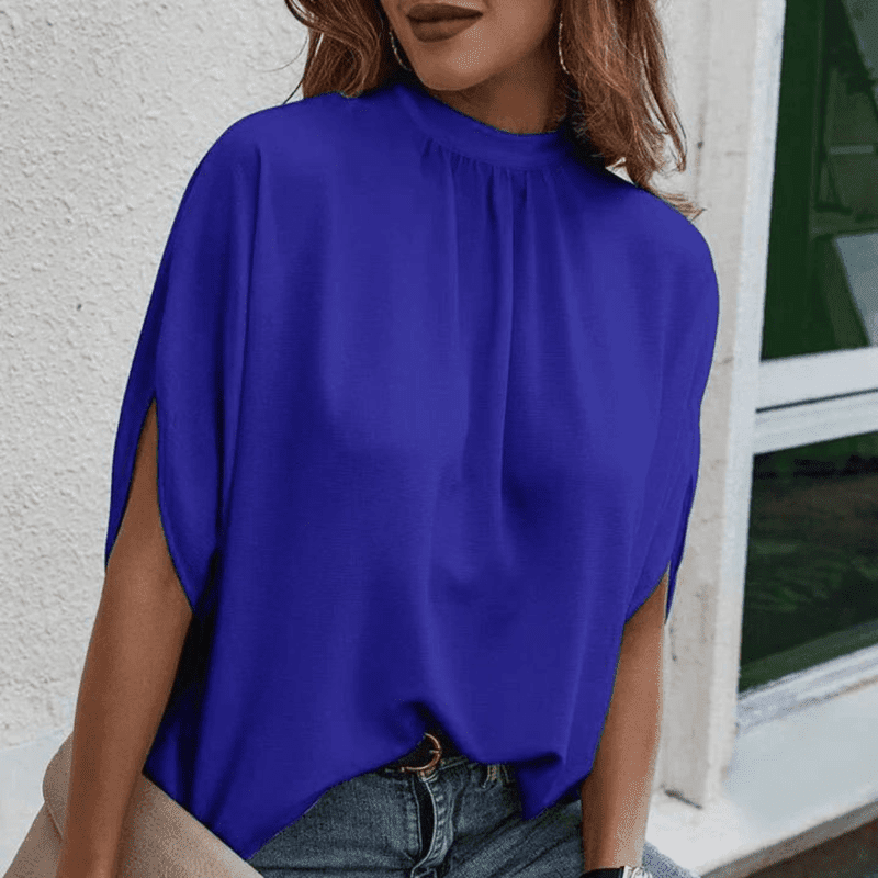 Profesjonell damebluse for kontoret med halvlange ermer og elegante splittdetaljer for et stilig uttrykk.
