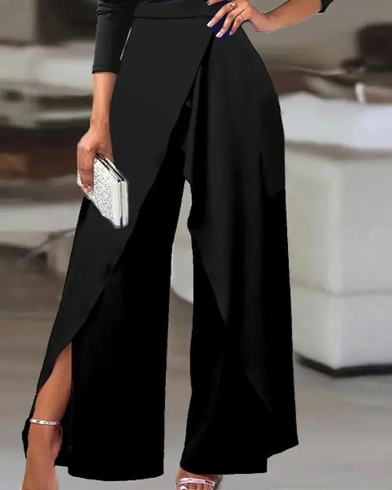 Elegant damejumpsuit med vide ben, kald skulder & splitt. Sofistikert design for fest og komfortabel mote.