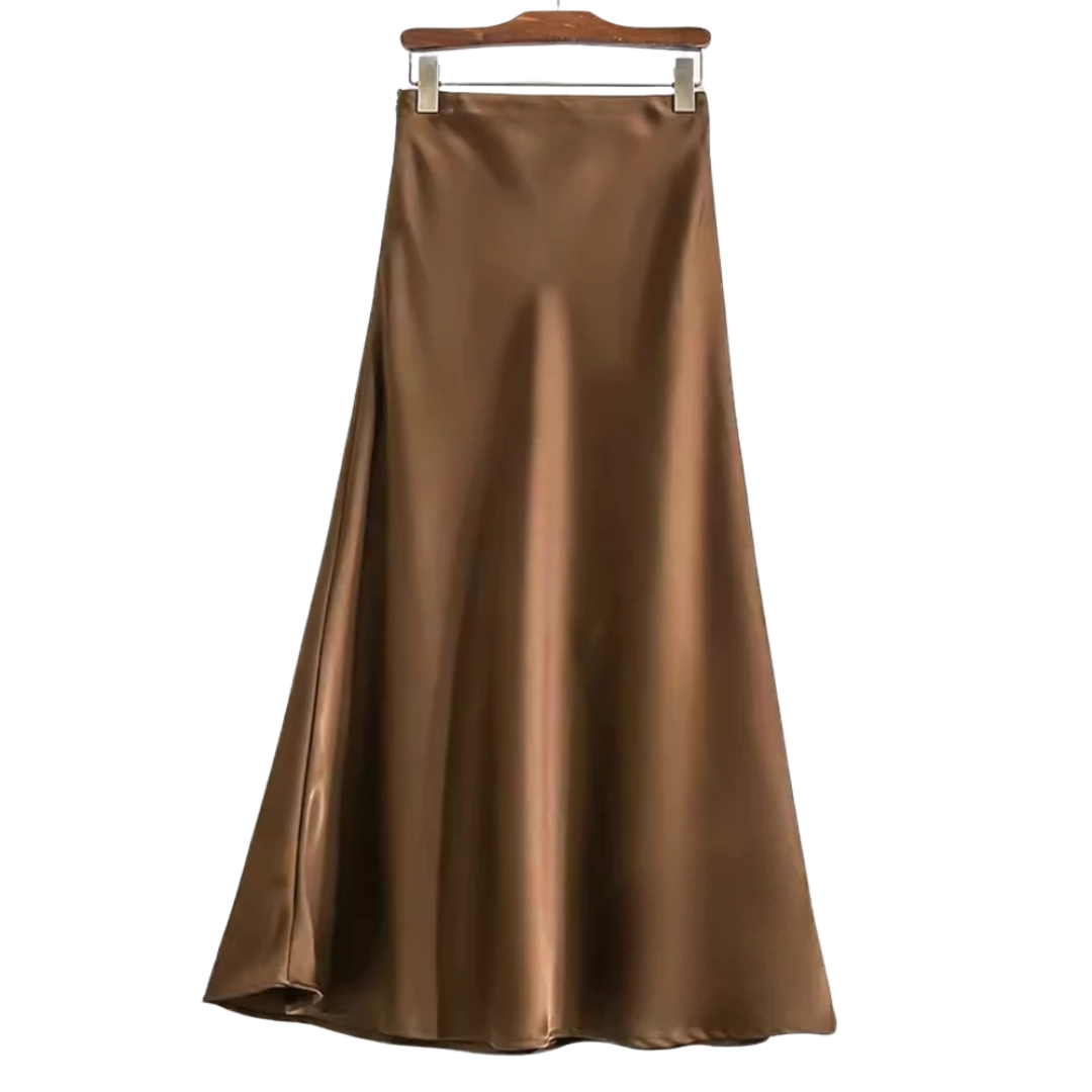 Stilfullt fiskehaleskjørt til fest og hverdag. Elegant damemote med flatterende midilengde.