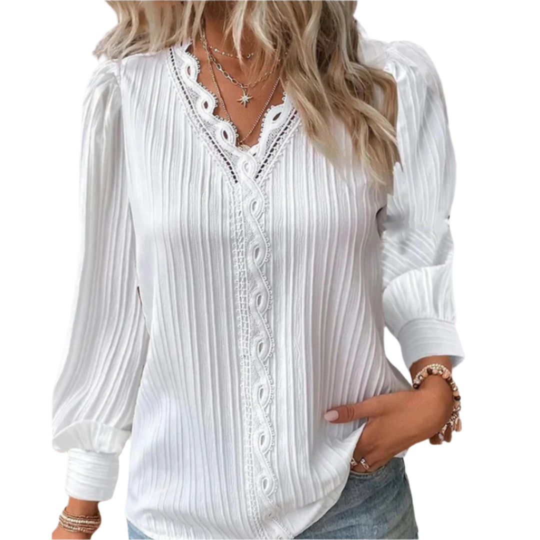 Elegant langermet damebluse med plisserte detaljer, perfekt for fest og kontor.
