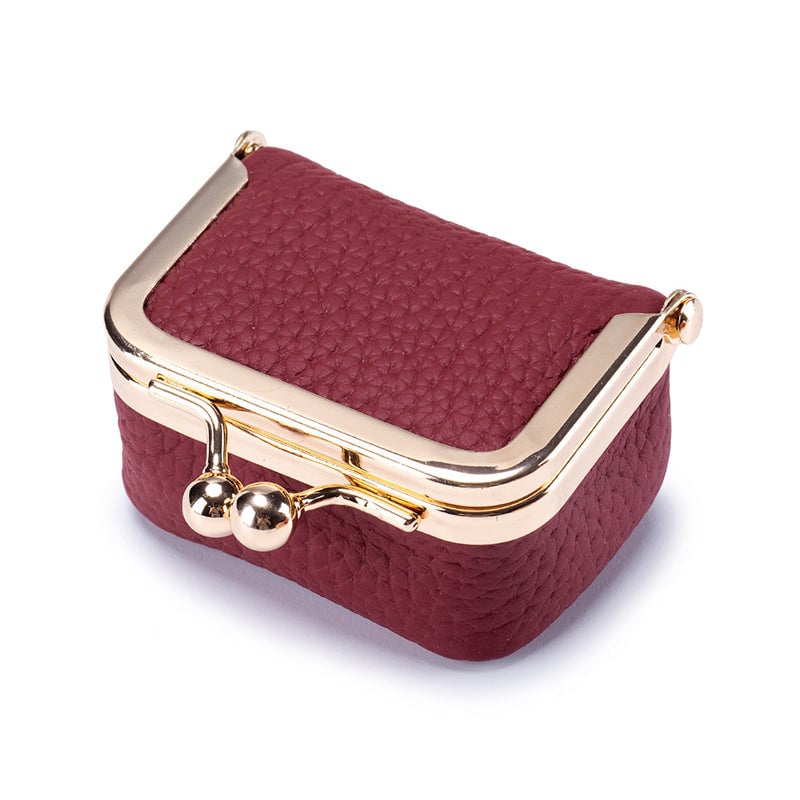 "Elegant mini smykkeskrin i ekte skinn med retro design, reisevennlig, tilgjengelig i flere stilige farger."