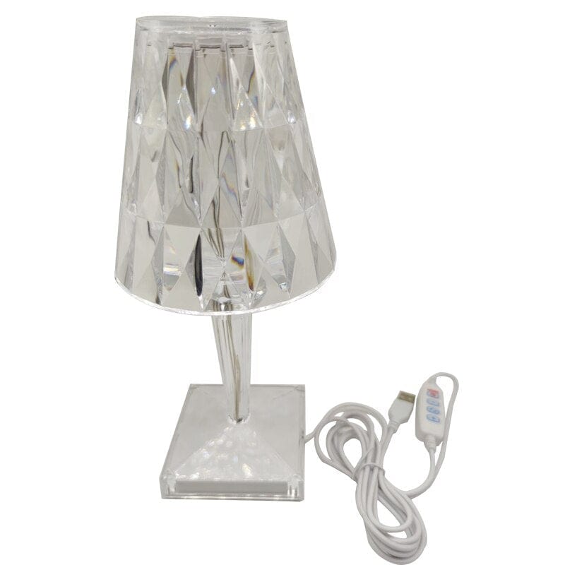 Elegant oppladbar bordlampe med unikt diamantdesign, perfekt for moderne interiør og stemningslys.