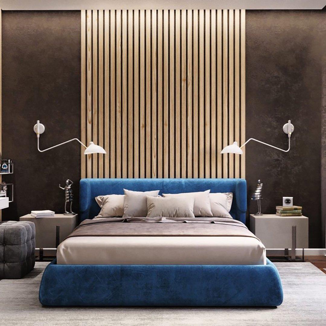 "Elegant Serge Mouille vegglampe med justerbar arm, insektlignende design, passer moderne innredning i svart eller hvit."