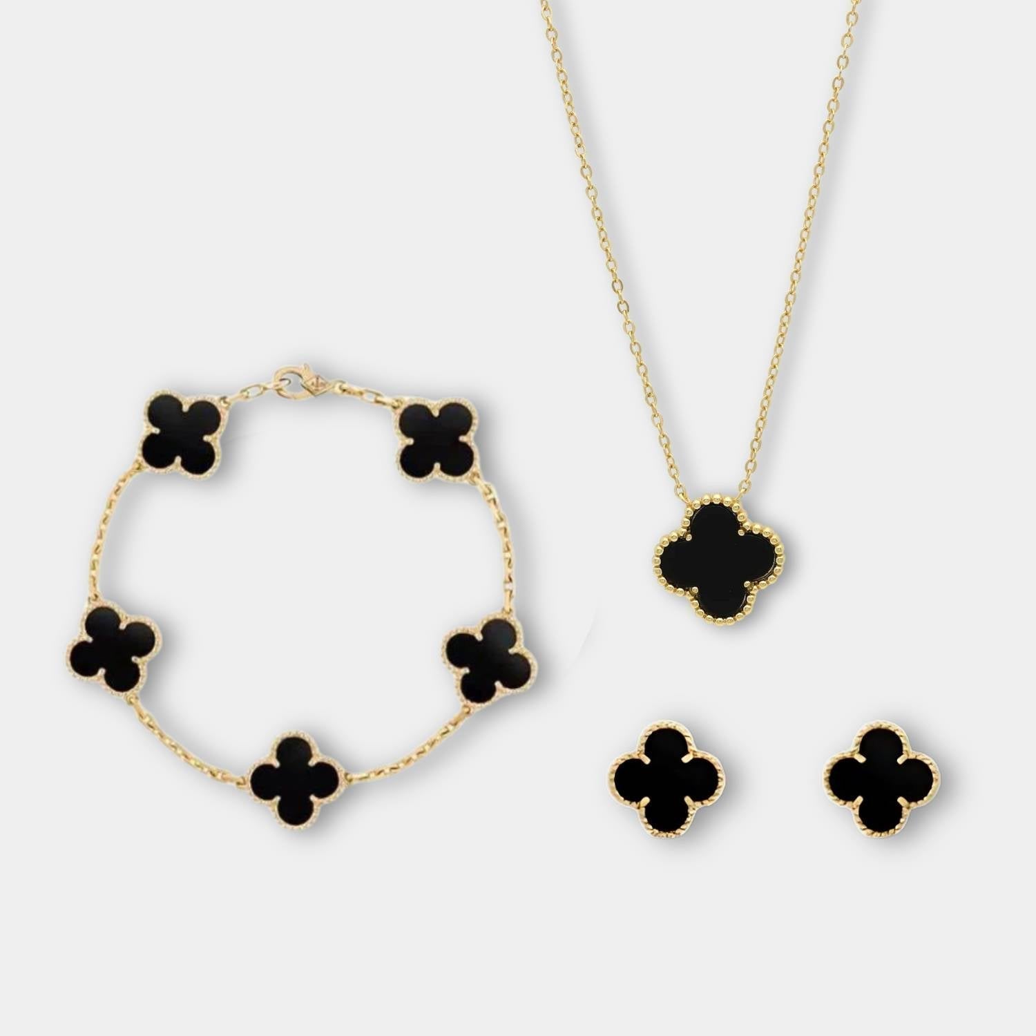 "Elegant smykkesett med minimalistisk halskjede, armbånd og øredobber i moderne design, ideelt for enhver anledning."