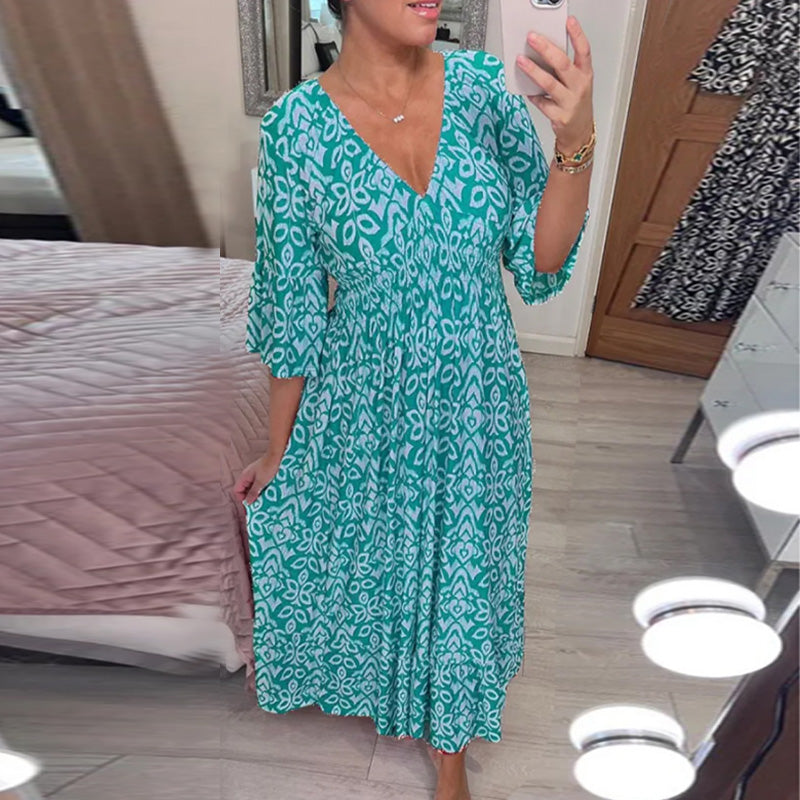 "Elegant V-hals maxi-kjole foran med flare-ermer og fargerikt trykk for kvinner. Perfekt A-line passform for vår og sommer."