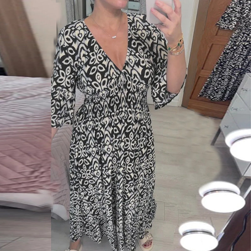 "Elegant V-hals maxi-kjole foran med flare-ermer og fargerikt trykk for kvinner. Perfekt A-line passform for vår og sommer."