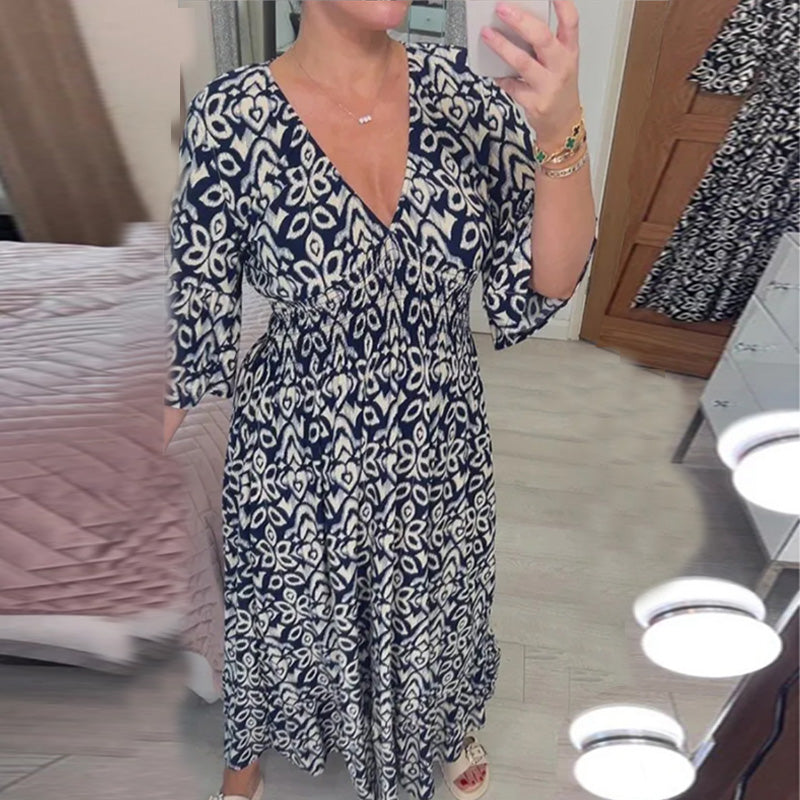 "Elegant V-hals maxi-kjole foran med flare-ermer og fargerikt trykk for kvinner. Perfekt A-line passform for vår og sommer."