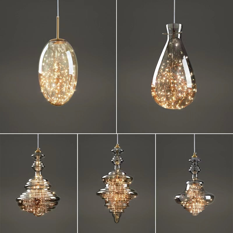 "Elegante moderne pendellampe i grått glass med stjernehimmel-effekt, justerbar høyde, perfekt for alle rom."