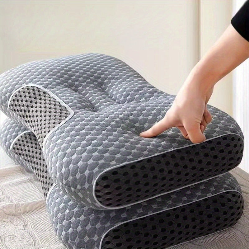 Komfortabel ergonomisk pute som fremmer bedre søvn, med form som tilpasser seg nakken for optimal hvile.
