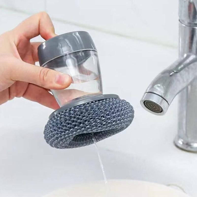 Praktisk kjøkkenskrubber med innebygd såpedispenser. Ergonomisk design for komfortabel og effektiv oppvask.
