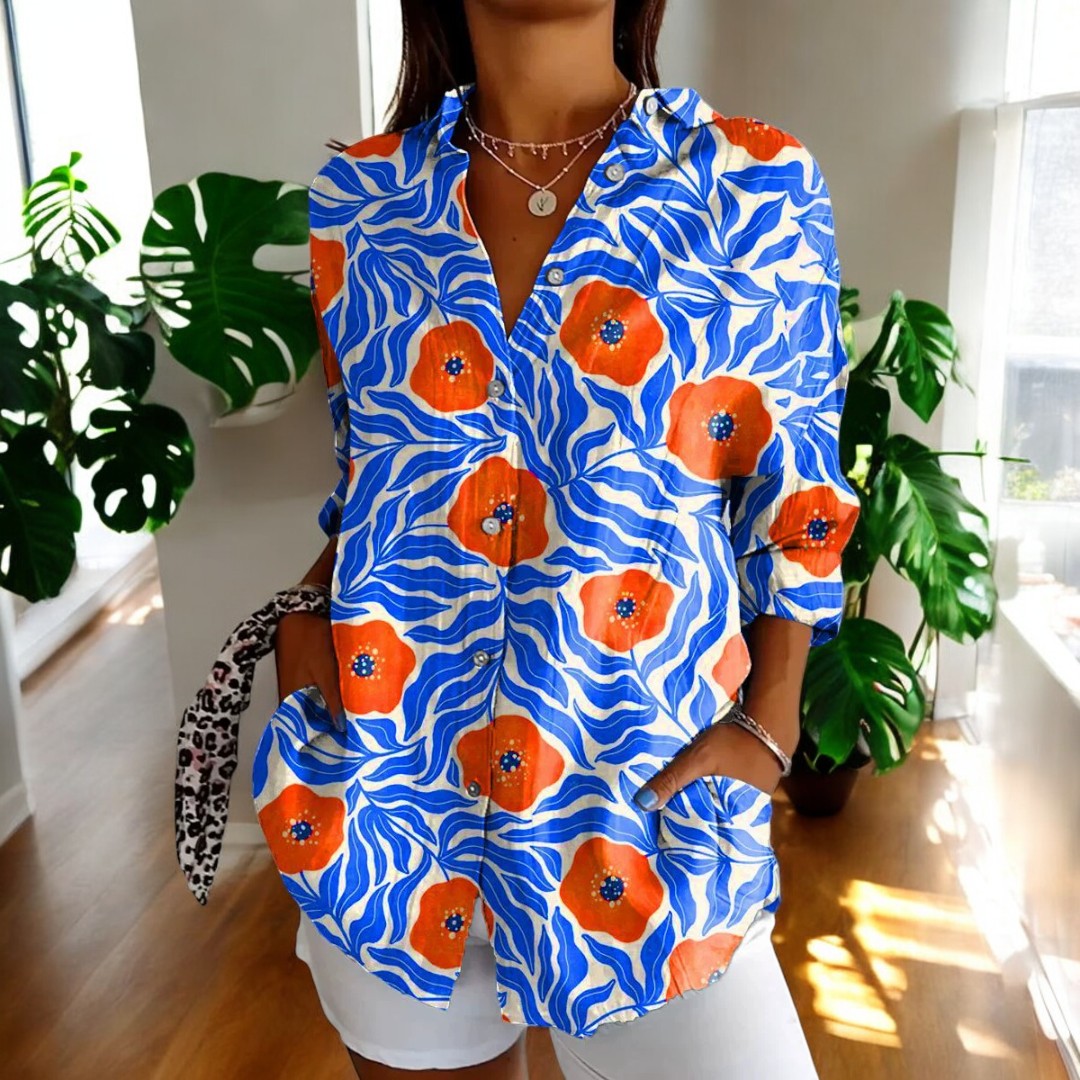 Allsidig vintage damebluse med fargerikt mønster, gir et elegant og unikt utseende.