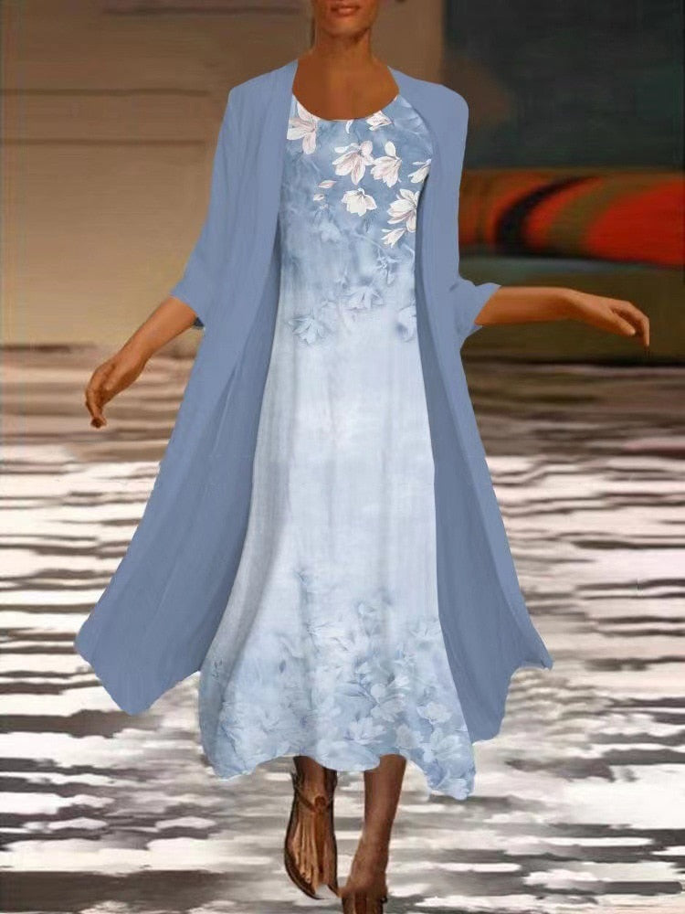 Behagelig damekjole med blomster til vår og sommer. Knelengde, casual stil.