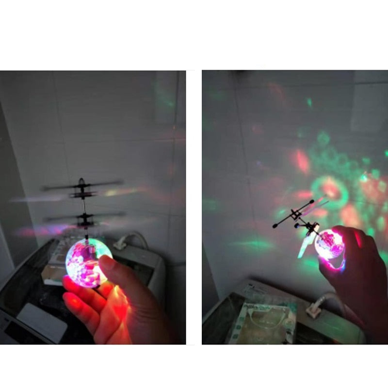 Flygende leke: LED helikopterball drone som svever like over et barns hånd med trygg induksjon