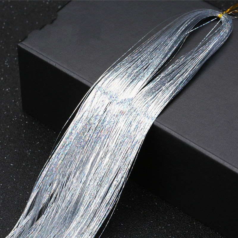 Pakke med tinsel hårforlengelser, assorterte farger for kreativ feststyling.