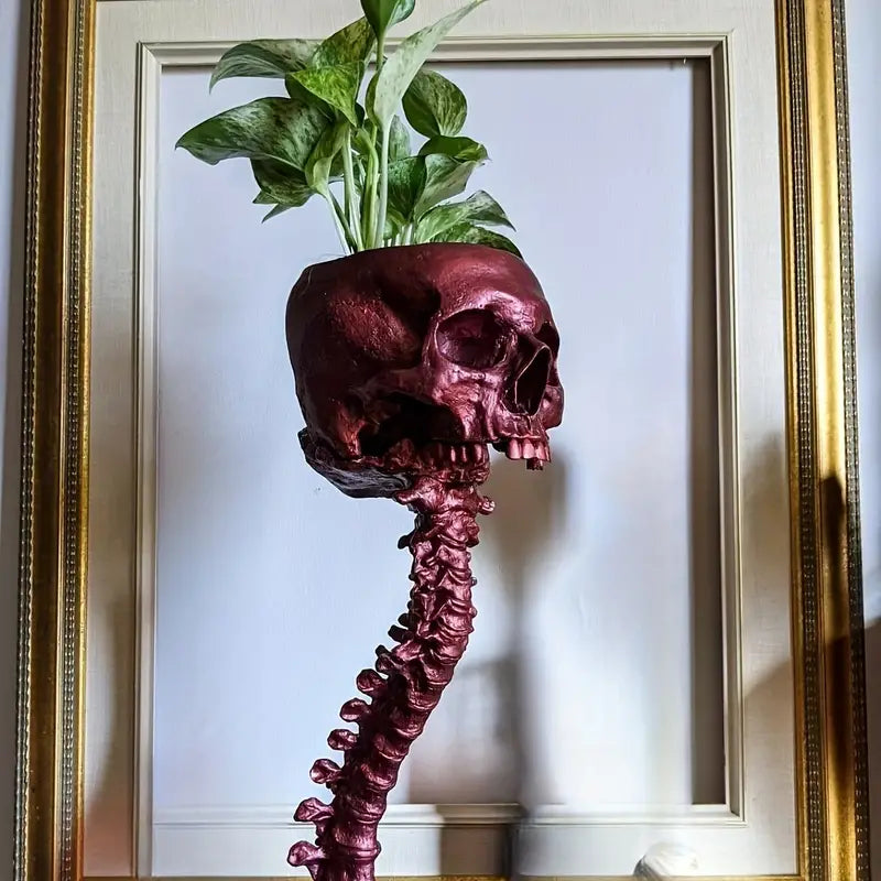 Halloween-tema hodeskalle og ryggrad plantepotte, unik borddekorasjon med makaber vri.