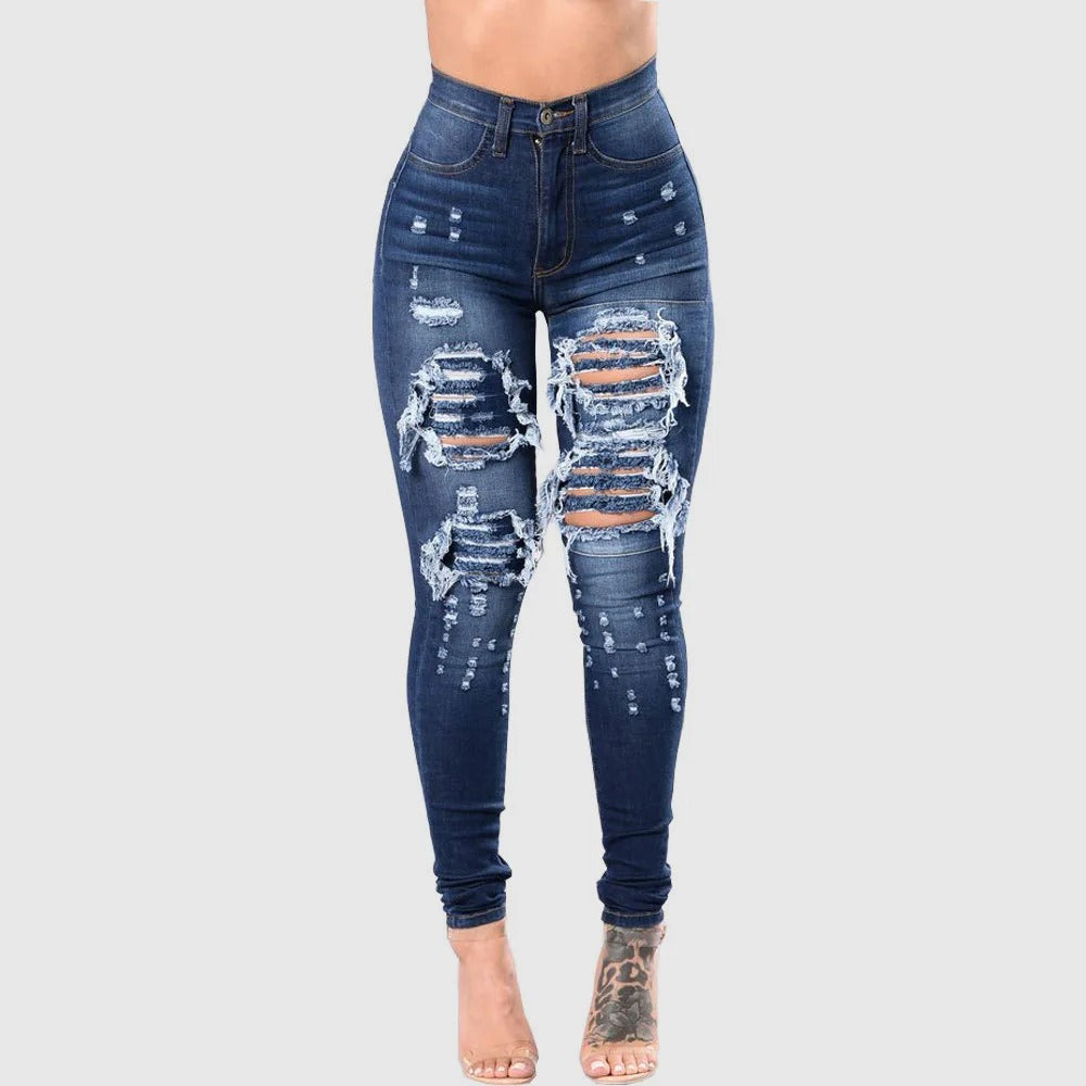 Kvinner med høy midje rippede jeans, slim fit i mørkeblå denim. Komfortable fritidsbukser.