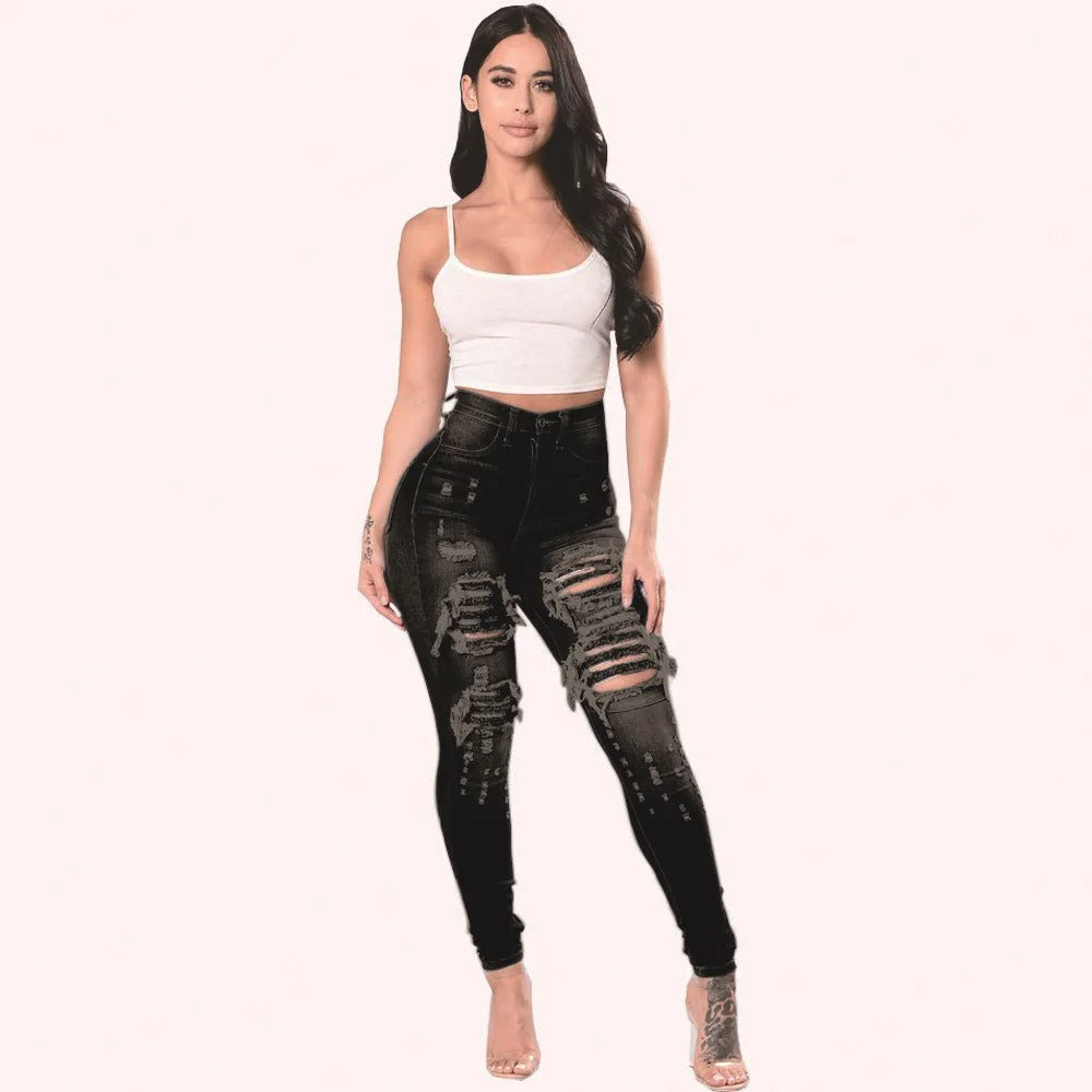 Detaljert bilde av trendy rippede skinny jeans for kvinner. Høy midje og slitasjedetaljer i blått.