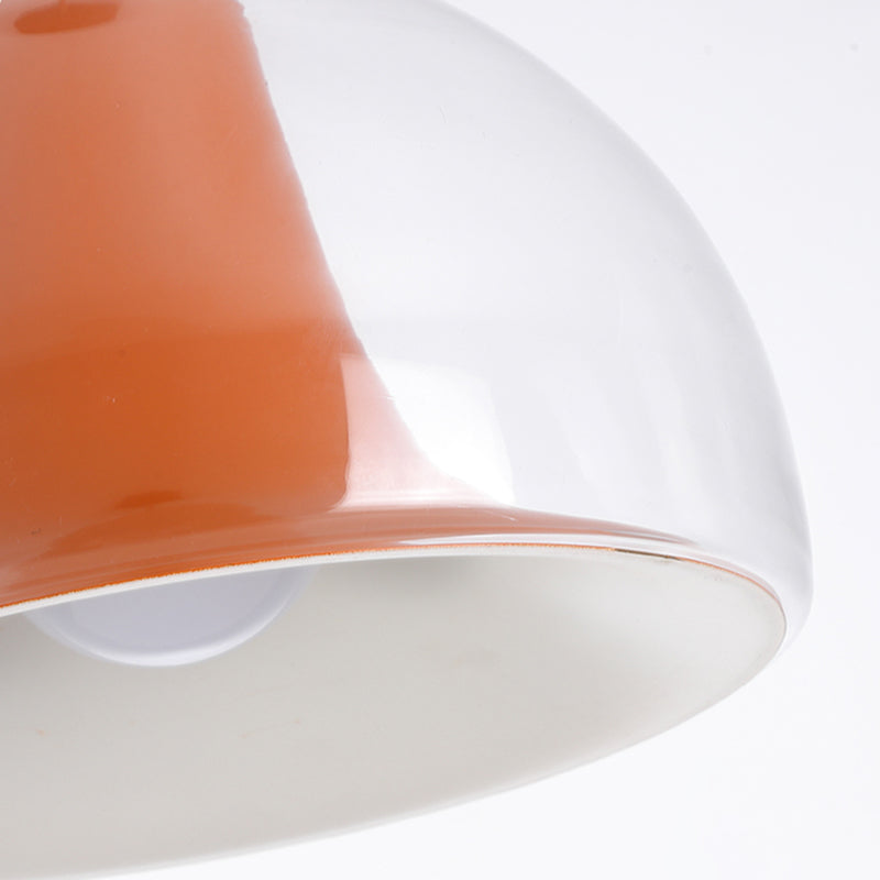 Halvsirkelformet glaspendel i Bauhaus-stil med myk glød, tilgjengelig i grønn, hvit og oransje for stilfull atmosfære.