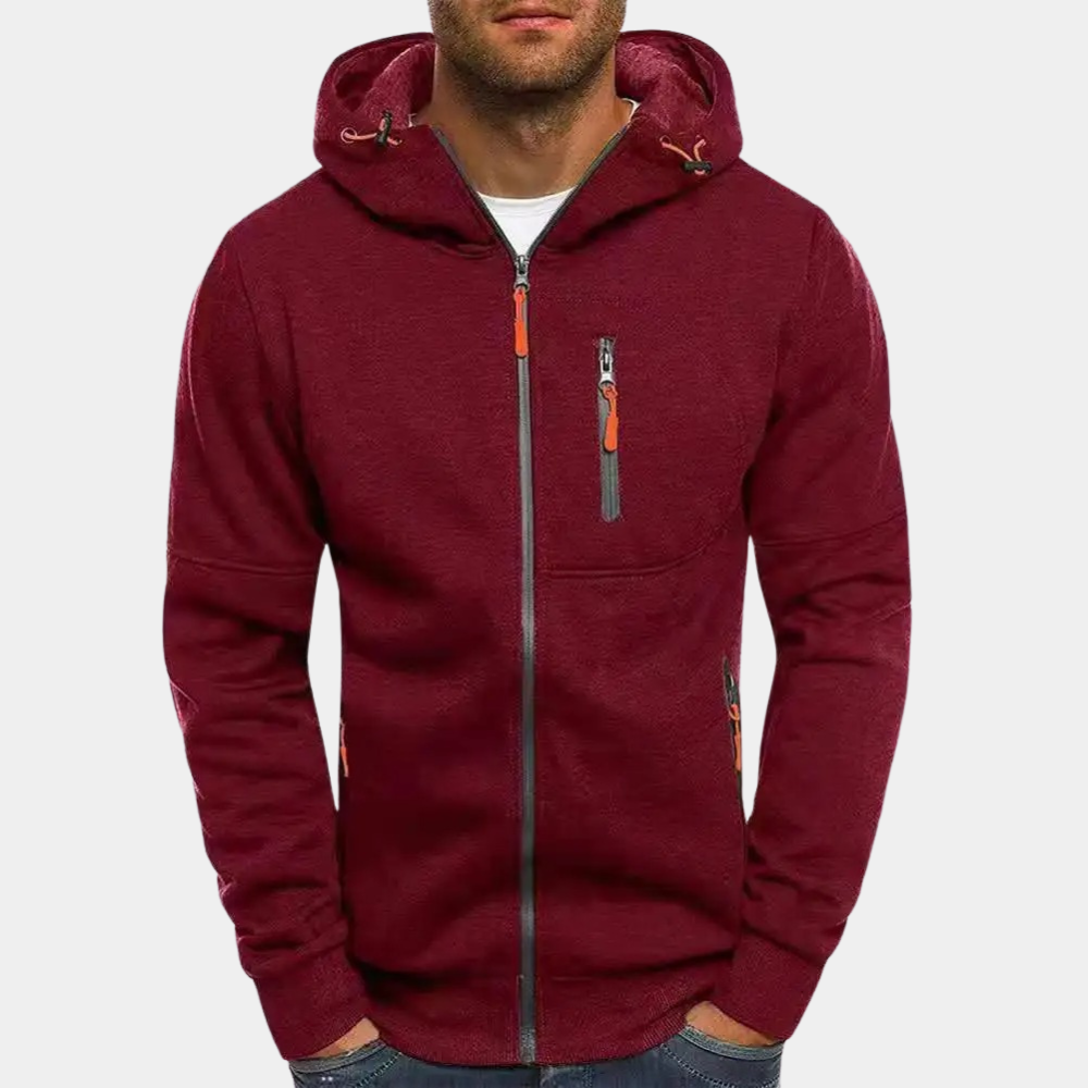 Nærbilde av stoffet på en flerfarget herresweater med glidelås og hette for menn.