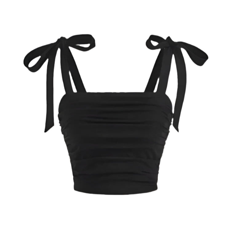 Hvit dame crop top med rysjer og bindeskulder. Perfekt sommertopp for en feminin og elegant stil.