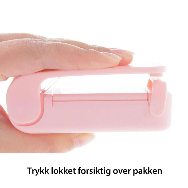 "Hvit håndholdt varmeposeforsegler for lufttett forseiling, ideell for å bevare mat friskere og redusere matsvinn."