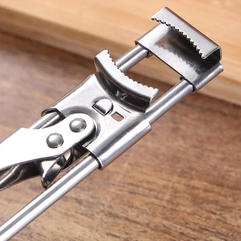 "Justerbar boksåpner i rustfritt stål med ergonomisk håndtak, skinnende overflate og moderne design for flasker i ulike størr