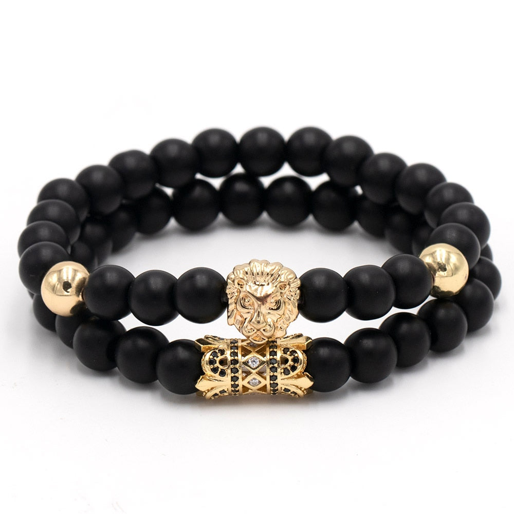 Klassisk løvearmbånd for kvinner med polerte natursteiner. Elegant damesmykke som symboliserer styrke og selvtillit.