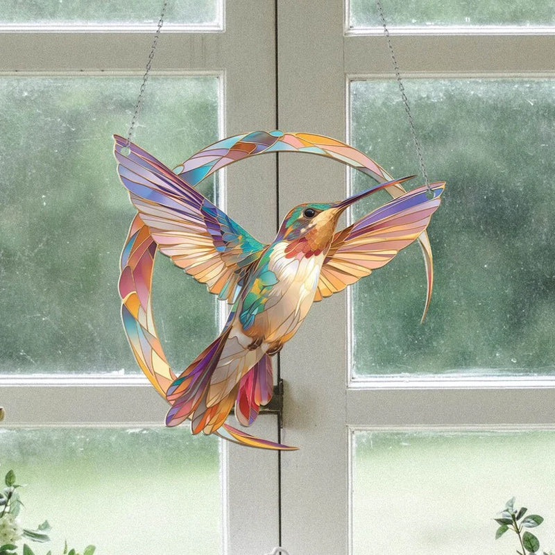 Innendørs kolibri solfanger, lilla krystaller, gir magiske regnbuer på vegg.