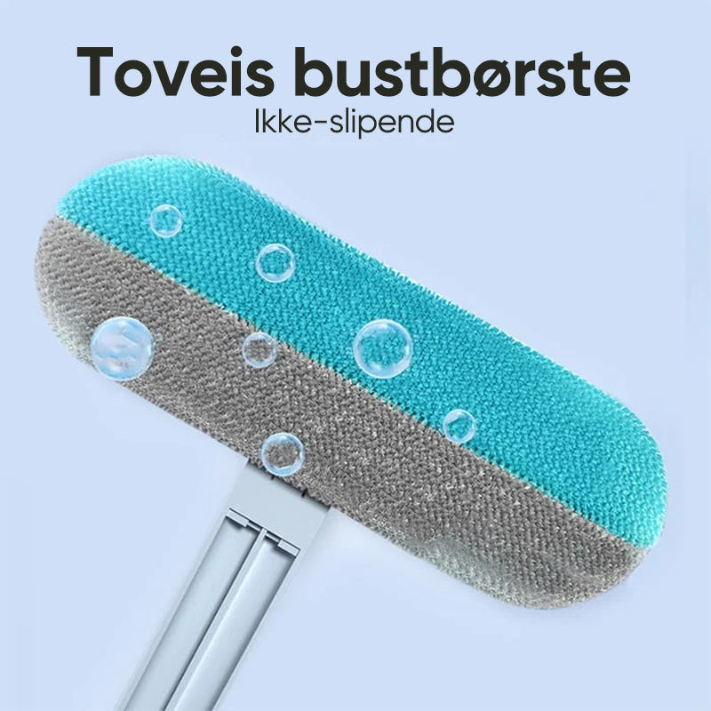 "Kompakt lyseblå kjæledyrhårfjerner på mørkt teppe, effektiv løsning for fjerning av kjæledyrhår fra møbler og tekstiler."
