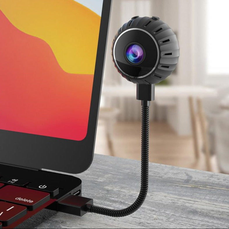 "Kompakt WiFi mini-sikkerhetskamera med 1080P HD, svart design, bevegelsesdeteksjon og infrarødt nattsyn."