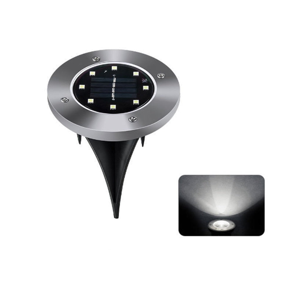 Moderne utendørs disklys med solcelleteknologi og 8 LED, gir solid lys langs terrassen.