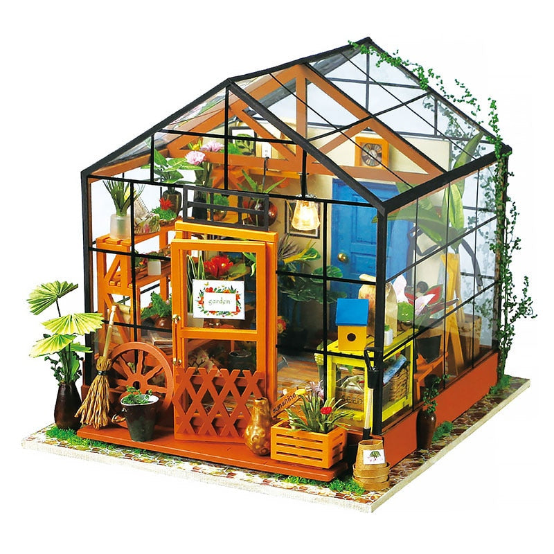 Barn som bygger et DIY miniatyrhus i tre med en voksen. Moro og lærerik hobby.