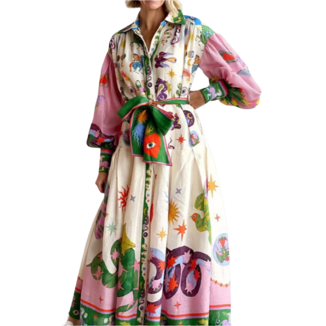 Kvinne maxikjole med voluminøse ermer og elegant belte, perfekt for vår og sommer.