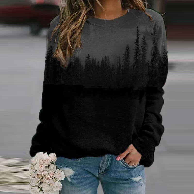 Nærbilde av damegenser med detaljert fjelltrykk. Trendy, varm pullover, perfekt for fritid og gaveidé.